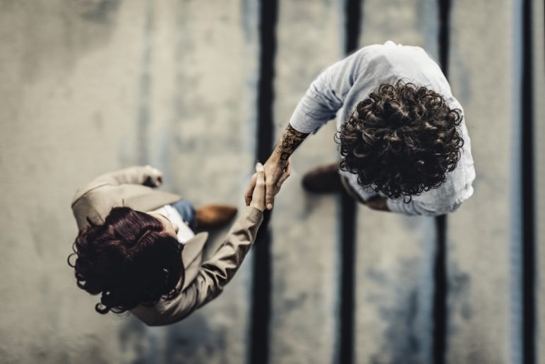 Man and woman shaking hands