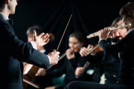 Conductor with orchestra