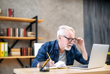 Man looking at laptop.