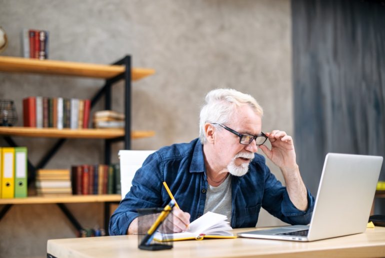 Man looking at laptop.